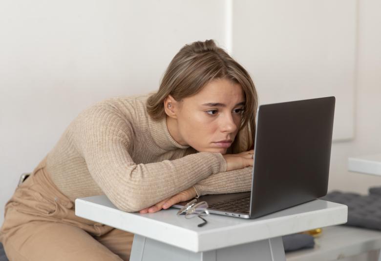 Sleeping Person on a Laptop